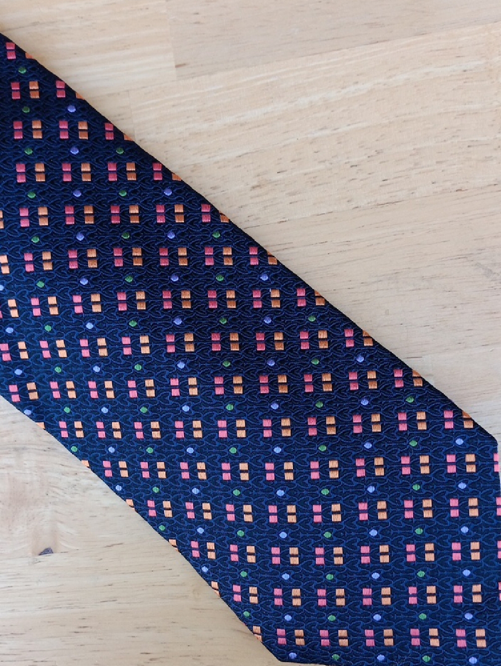 Navy Men's Tie with Reddish Orange, Yellow, and Green Geometric Accents
